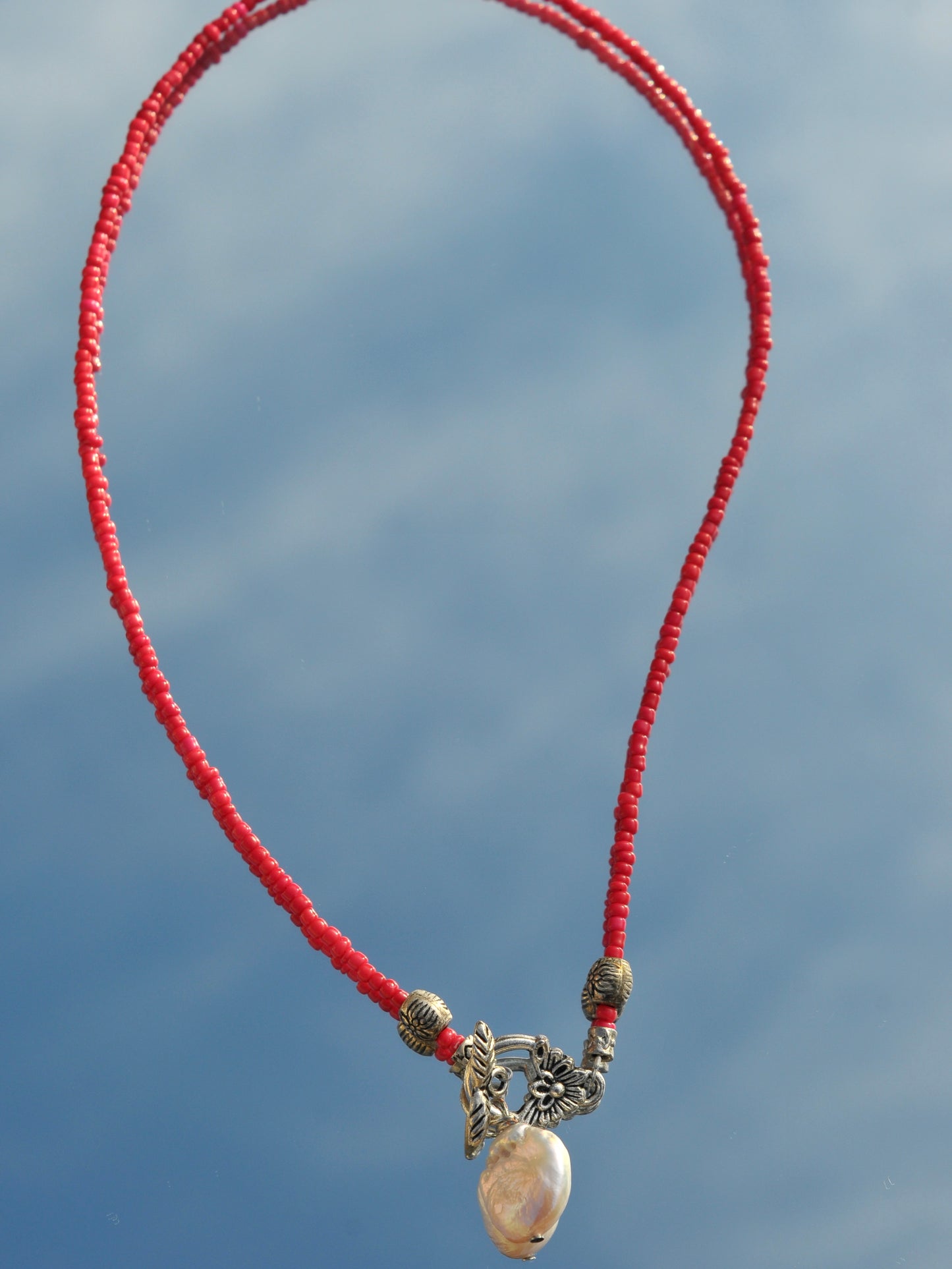 Red beaded sterling silver front clasp necklace